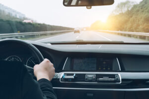 man driving car from rear view